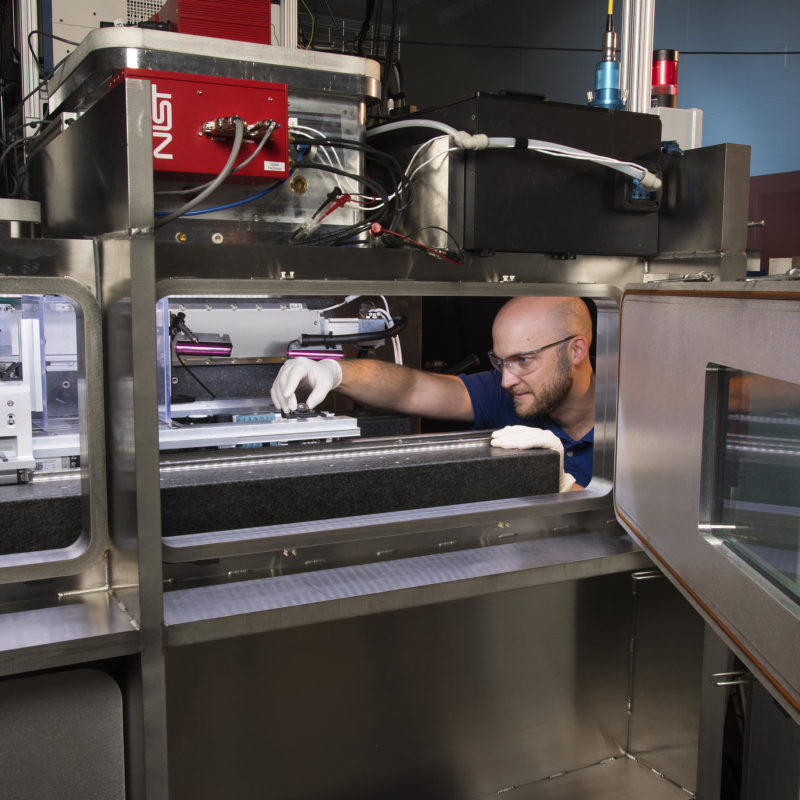 man working on a 3D printer