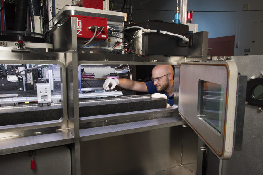 man working on a 3D printer