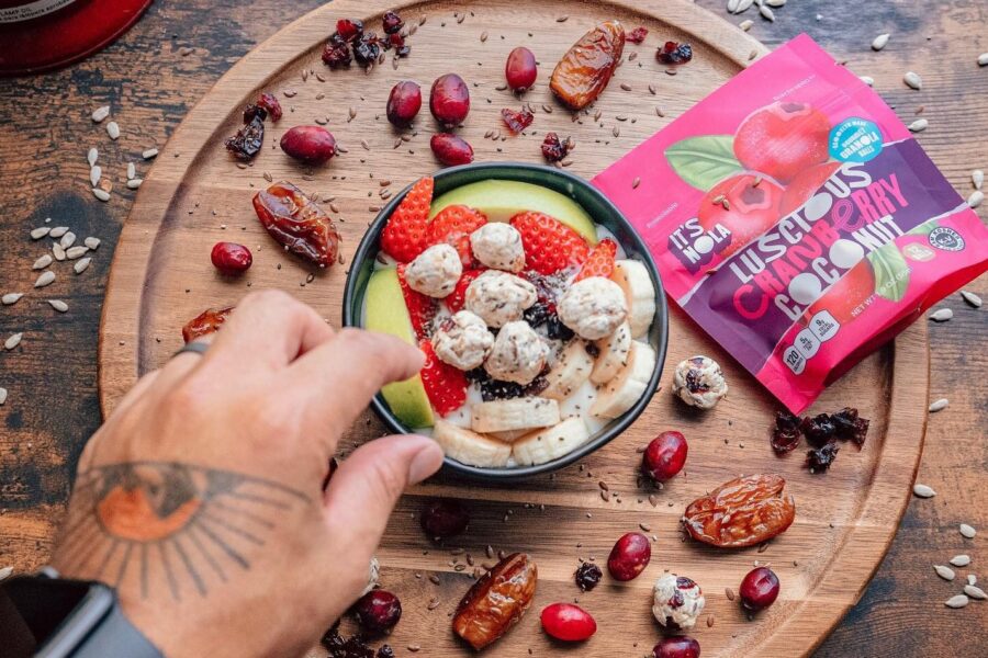 it's nola granola on a serving plate with fruit