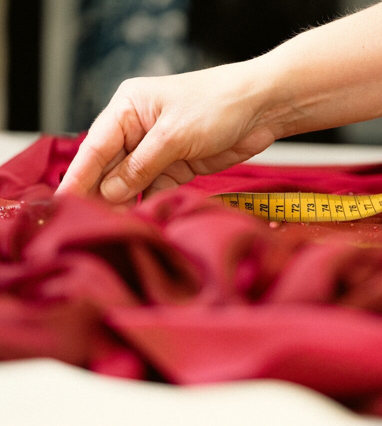 measuring tape on red fabric