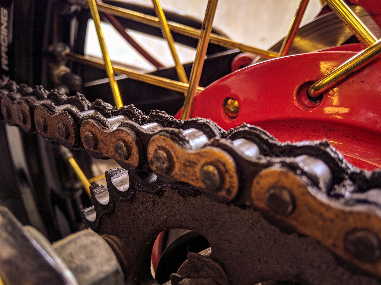 close up of bicycle chain on a red bike