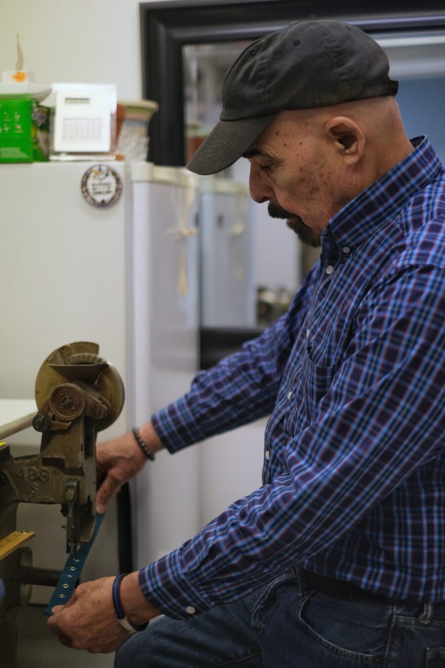Photo of Louis Vasquez working on a machine