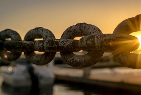 photo of a chain with a sunset