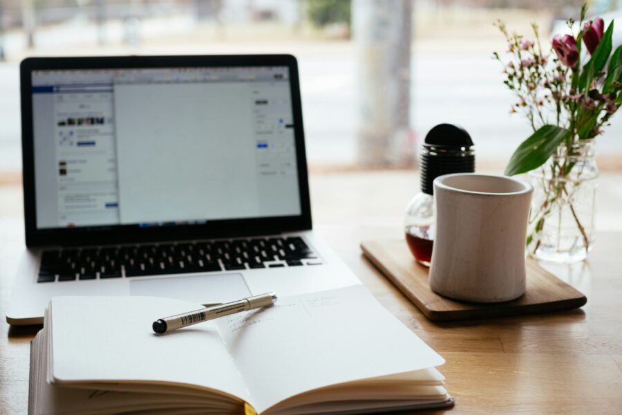 open notebook and pen on a desk