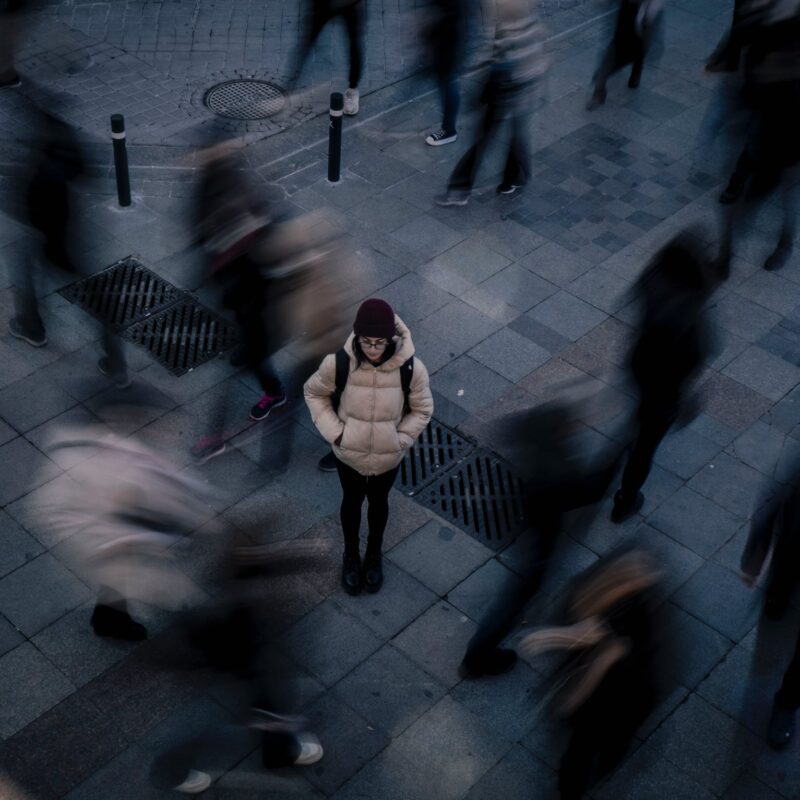 one person standing out in a crowd