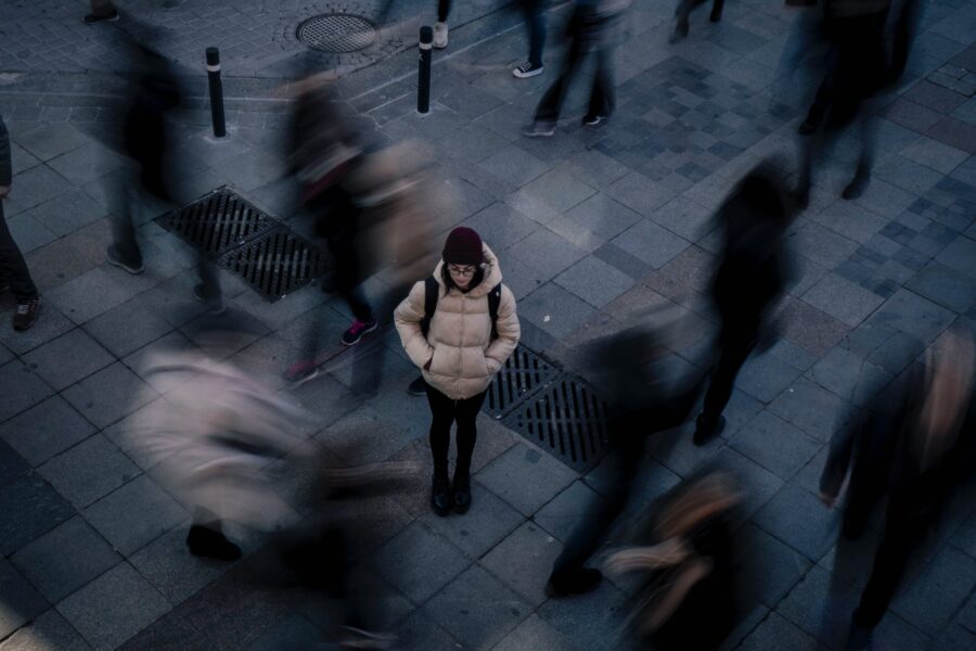 one person standing out in a crowd