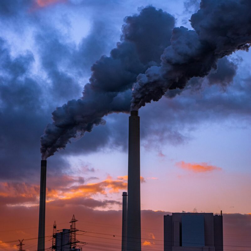 Smoking Industrial Chimneys in the Evening