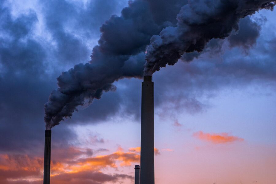Smoking Industrial Chimneys in the Evening