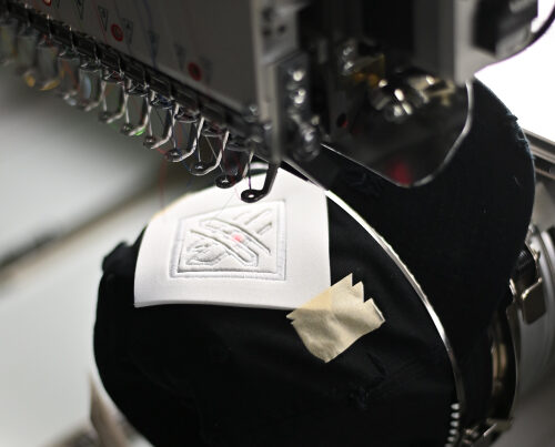 embroidery machine sewing a hat