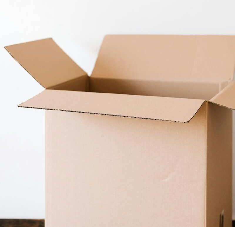open cardboard box on a wood table