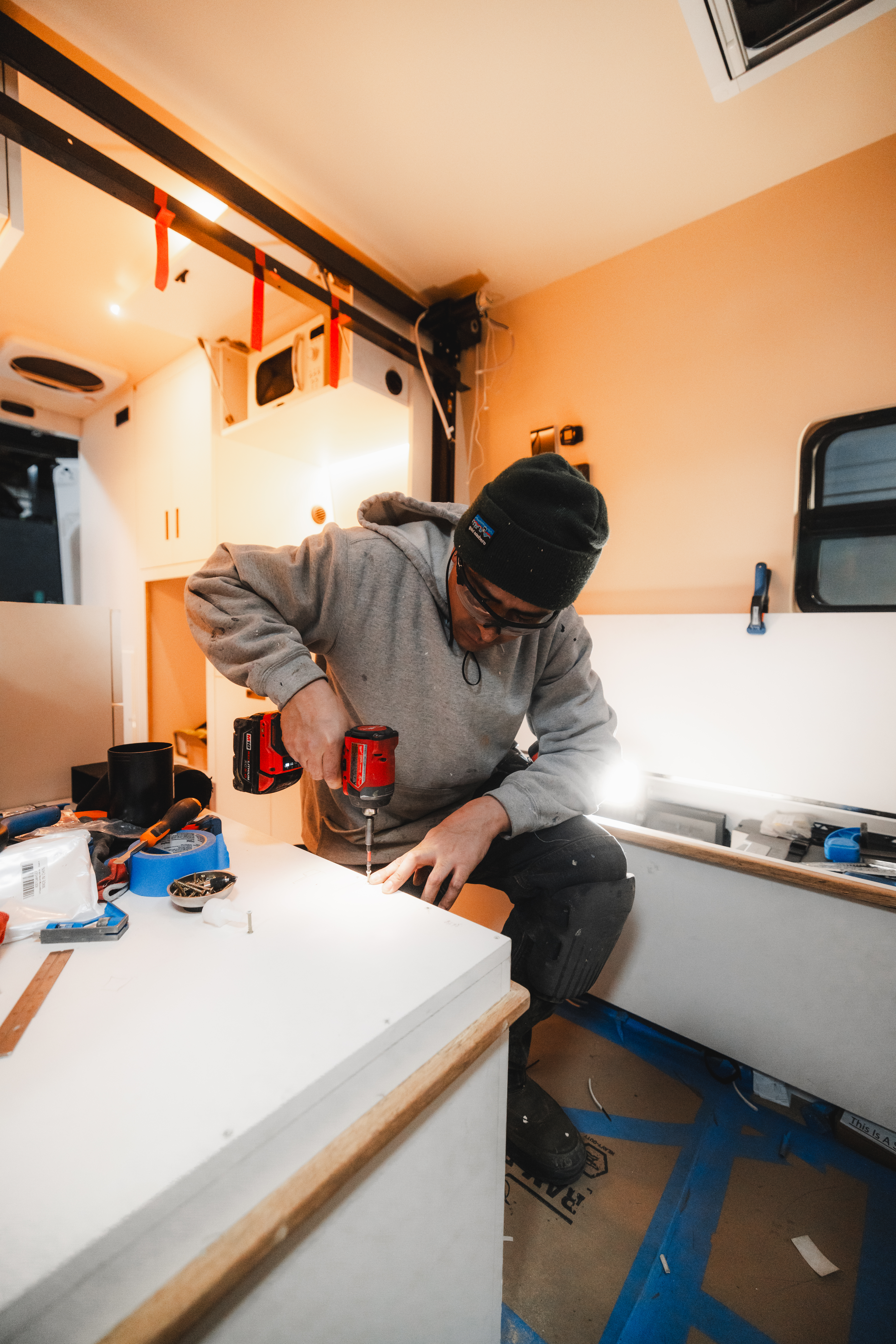staff working on a custom camper van